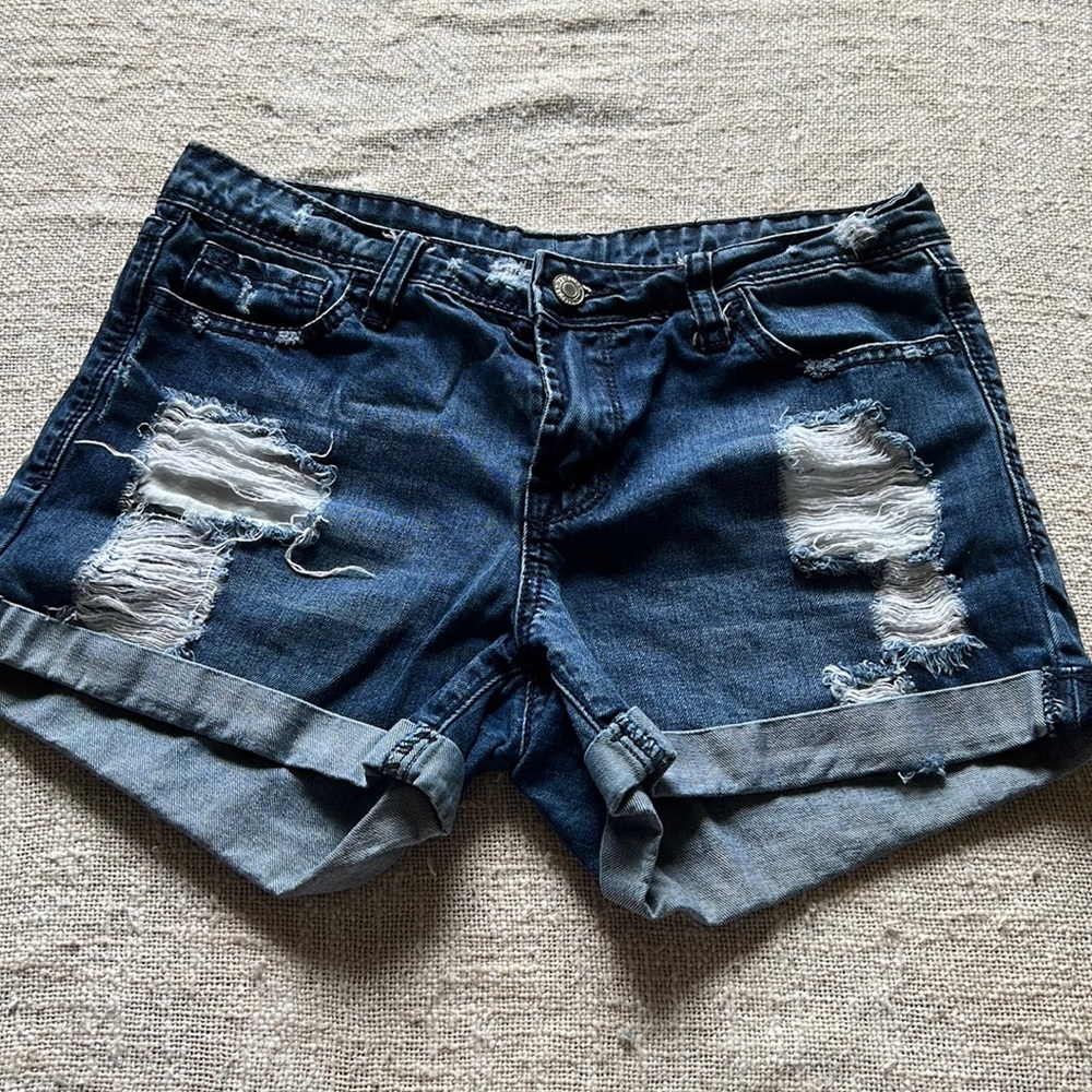 Distressed blue jean shorts